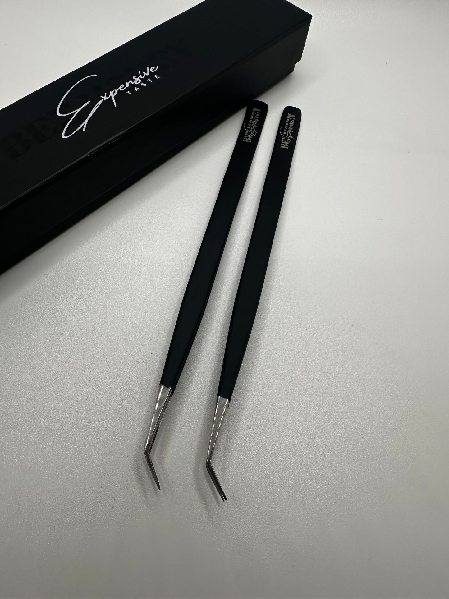 Curved isolation tweezers